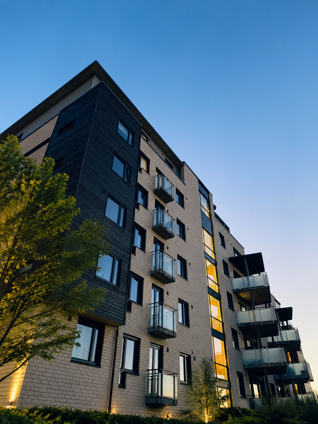 Modern apartment building exterior at dusk
